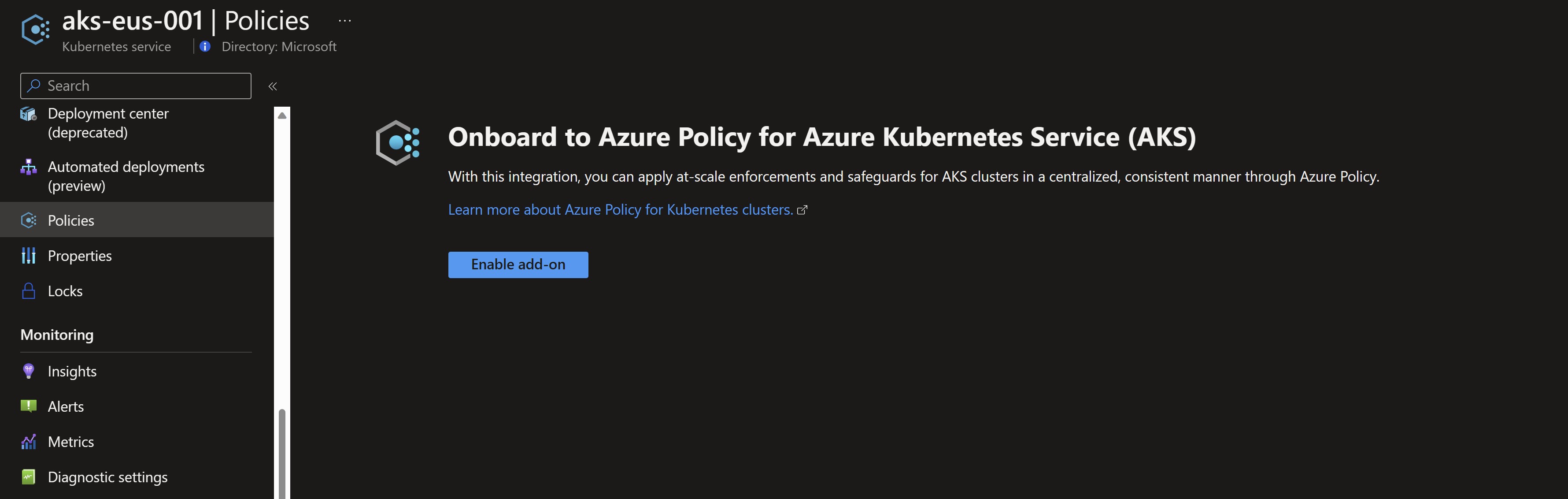 Screenshot showing the Azure Policy add-on not enabled on the first cluster